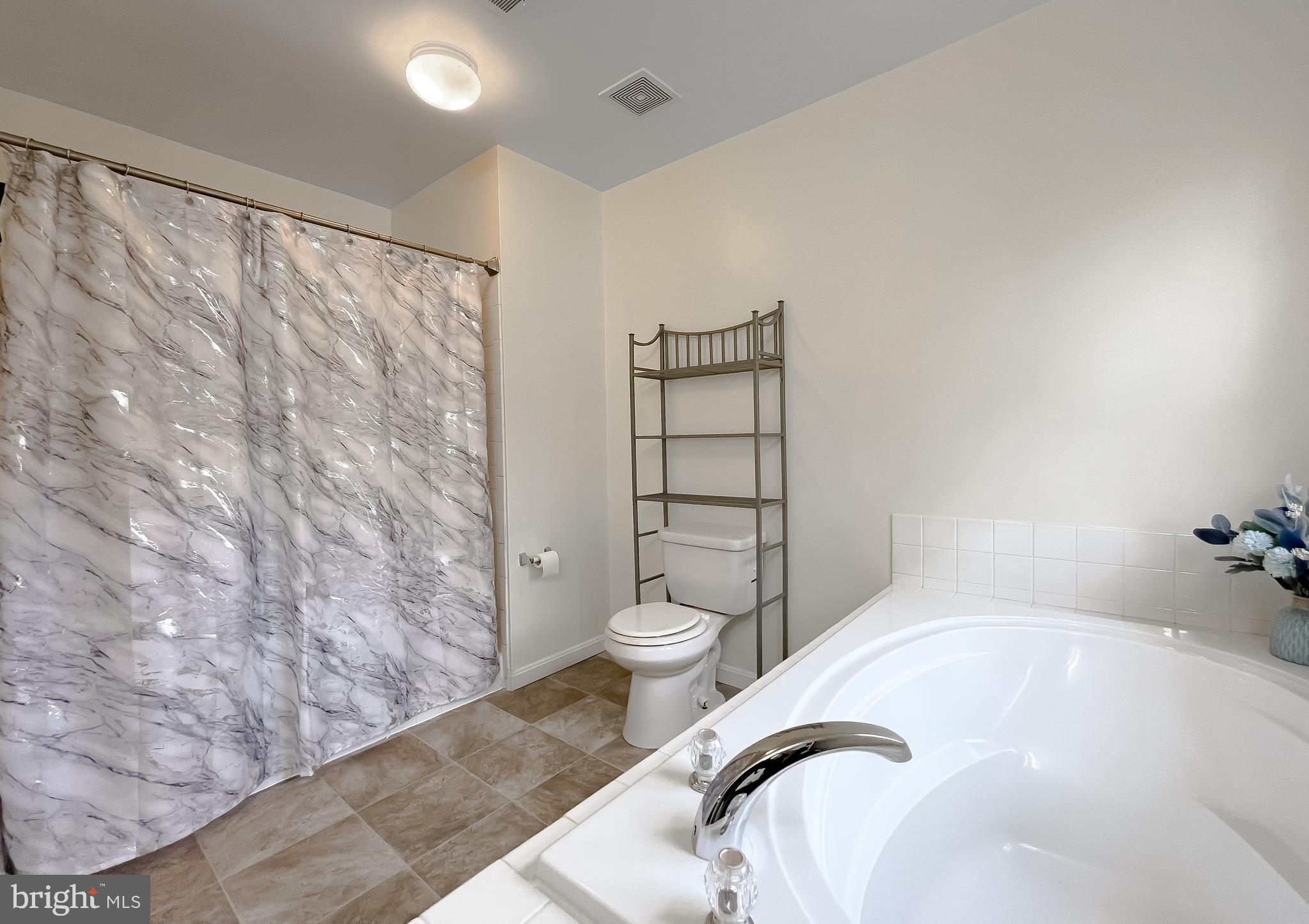 47162 Green Leaf Road Lexington Park, MD 20653 - Photo 32 of 50 a bathroom with a bathtub and toilet