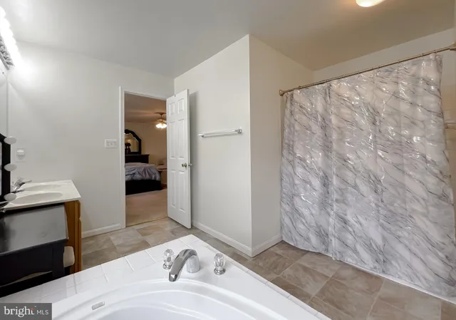 a bedroom with a bed and a night stand