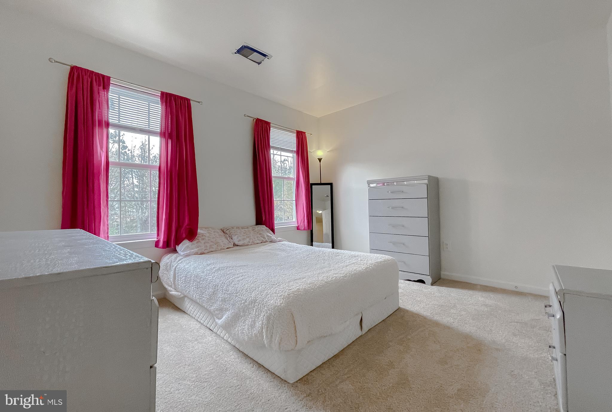 47162 Green Leaf Road Lexington Park, MD 20653 - Photo 41 of 50 a bedroom with a bed and dresser