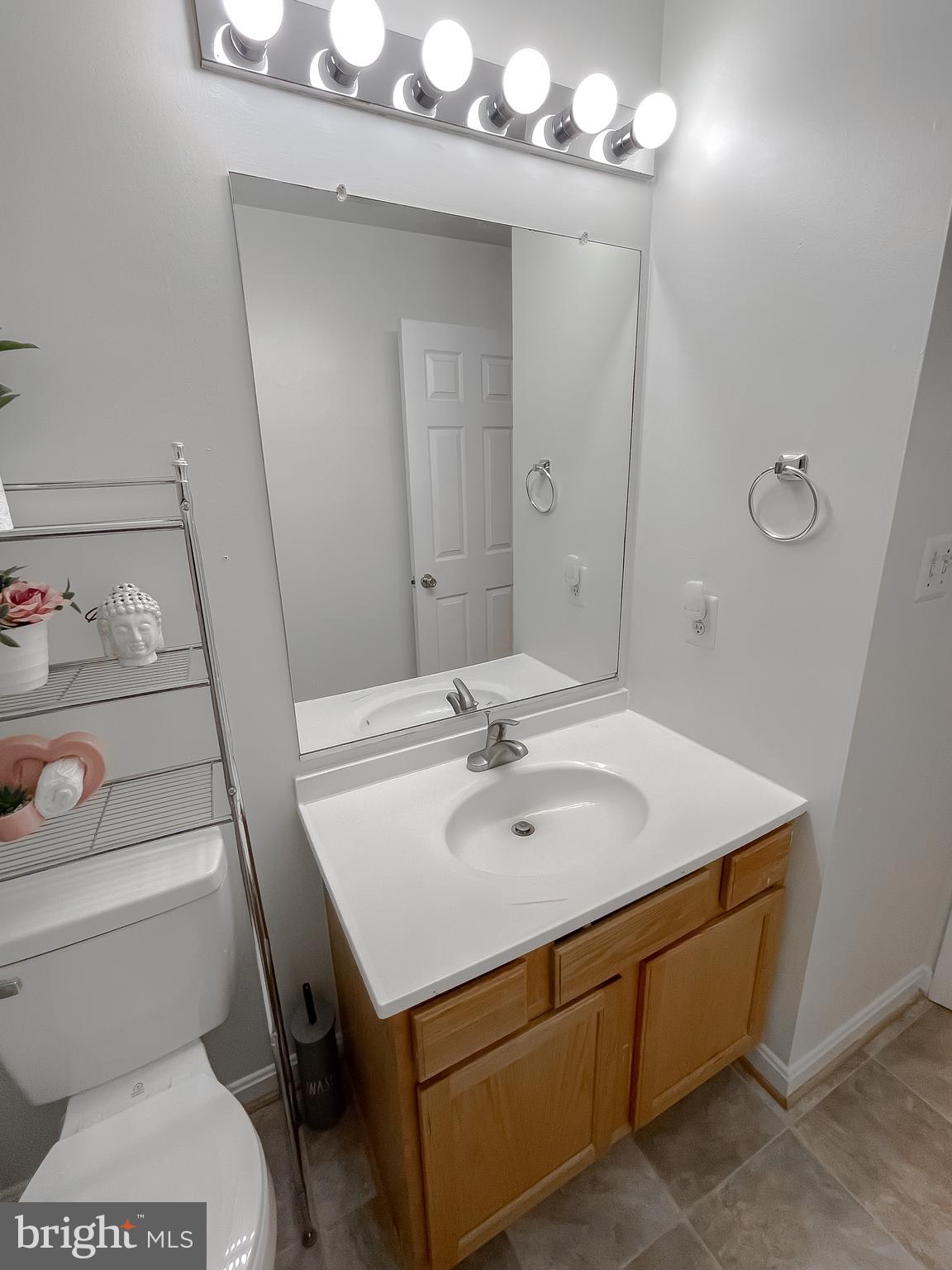 47162 Green Leaf Road Lexington Park, MD 20653 - Photo 43 of 50 a bathroom with a sink toilet vanity and tub
