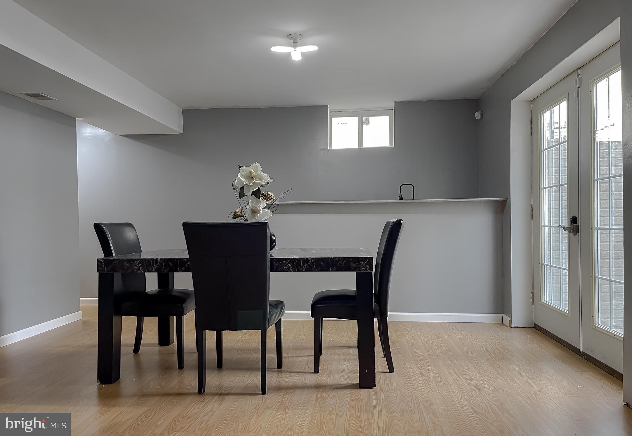 47162 Green Leaf Road Lexington Park, MD 20653 - Photo 47 of 50 a view of a dining room with furniture and a potted plant