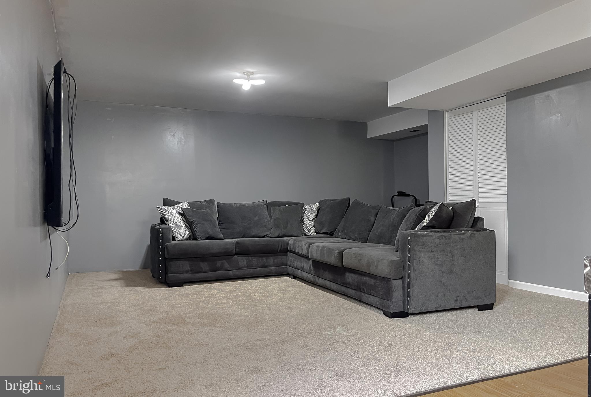 47162 Green Leaf Road Lexington Park, MD 20653 - Photo 48 of 50 a living room with furniture and a flat screen tv