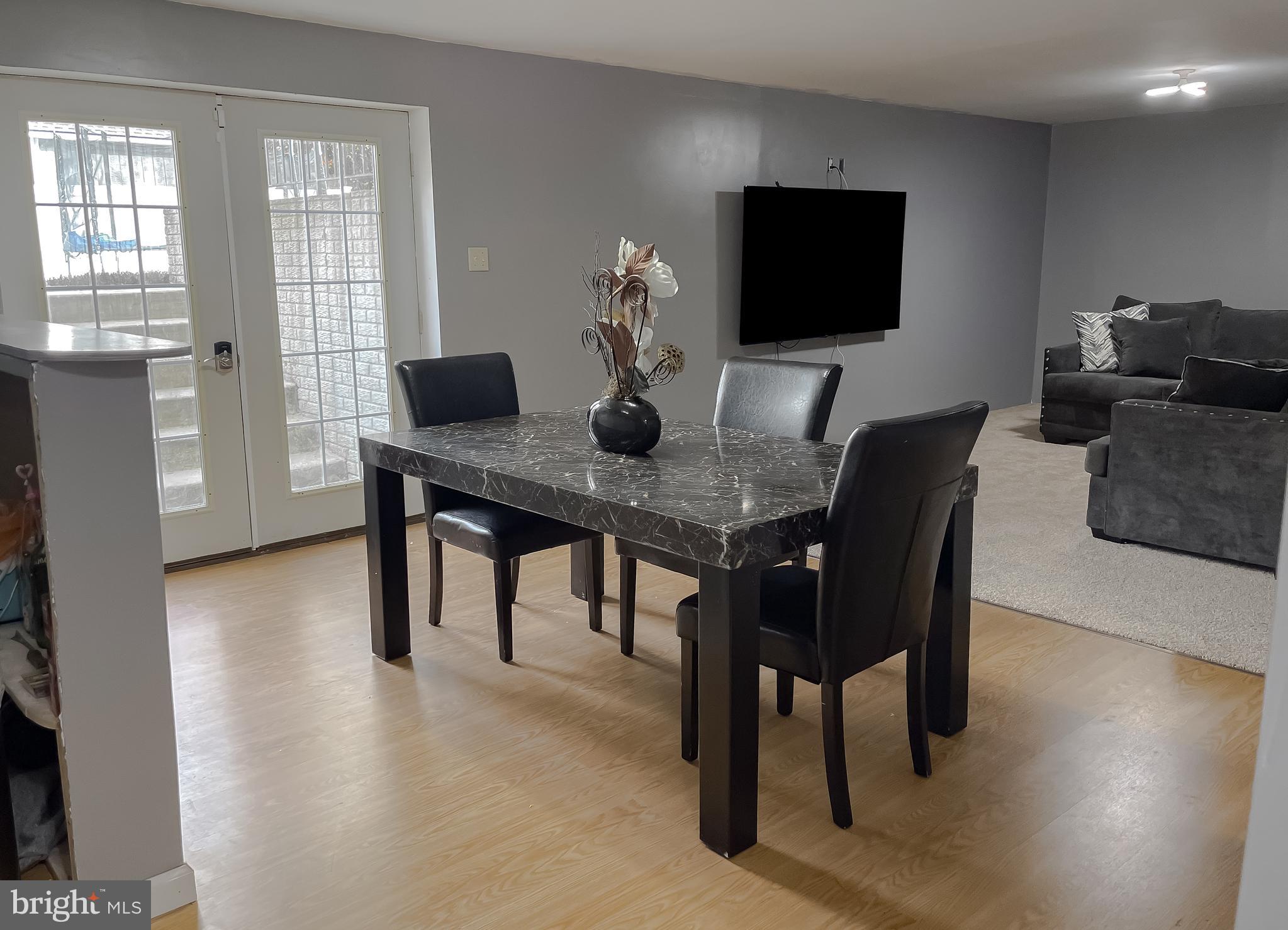 47162 Green Leaf Road Lexington Park, MD 20653 - Photo 49 of 50 a view of a dining room with furniture and wooden floor