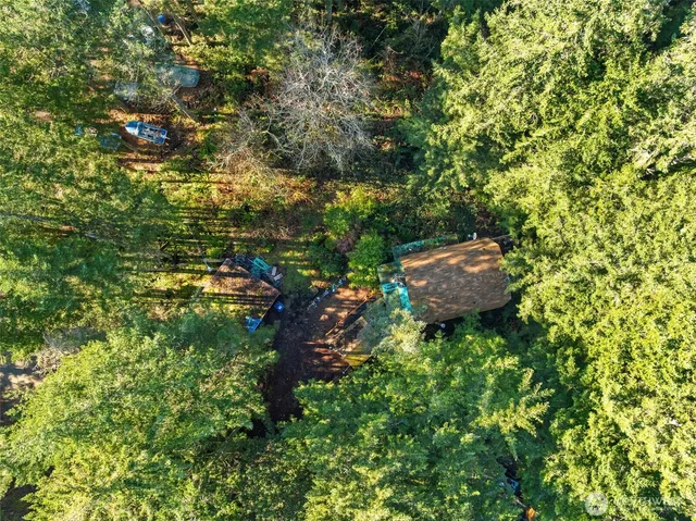 a backyard of a house with a yard and outdoor seating