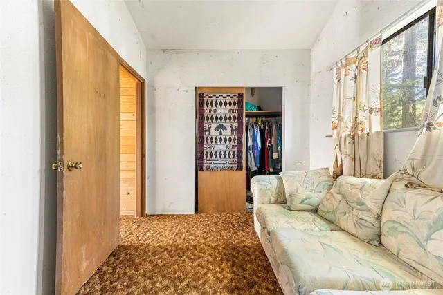 a living room with furniture and a rug