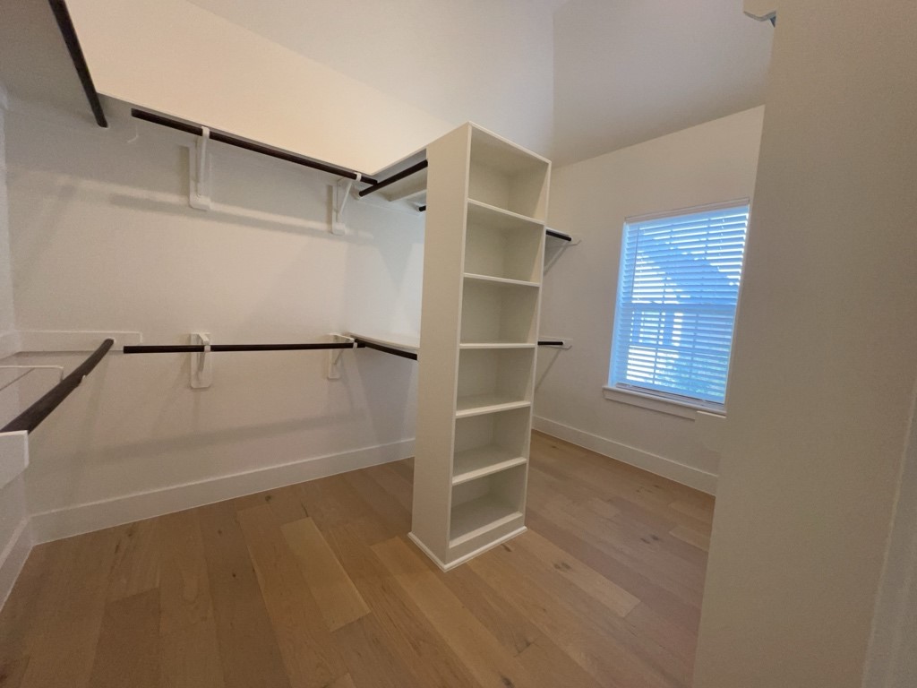 10607 Enclave Shadows Court Houston, TX 77043 - Photo 13 of 29 a view of an empty walk in closet
