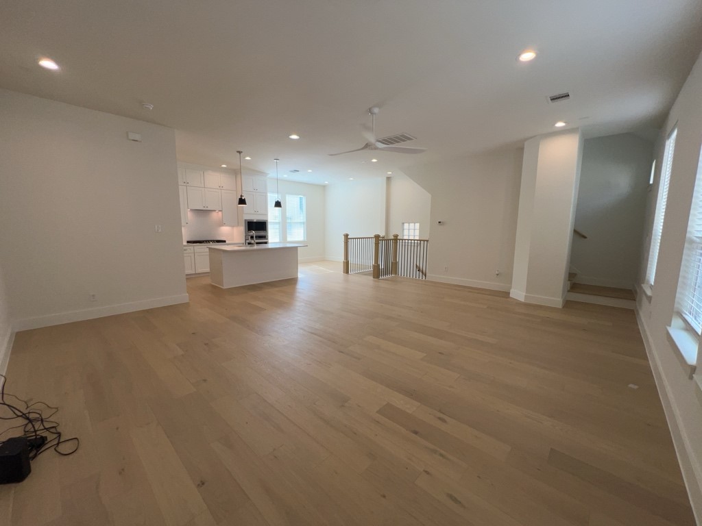 10607 Enclave Shadows Court Houston, TX 77043 - Photo 15 of 23 a view of a kitchen with refrigerator and window