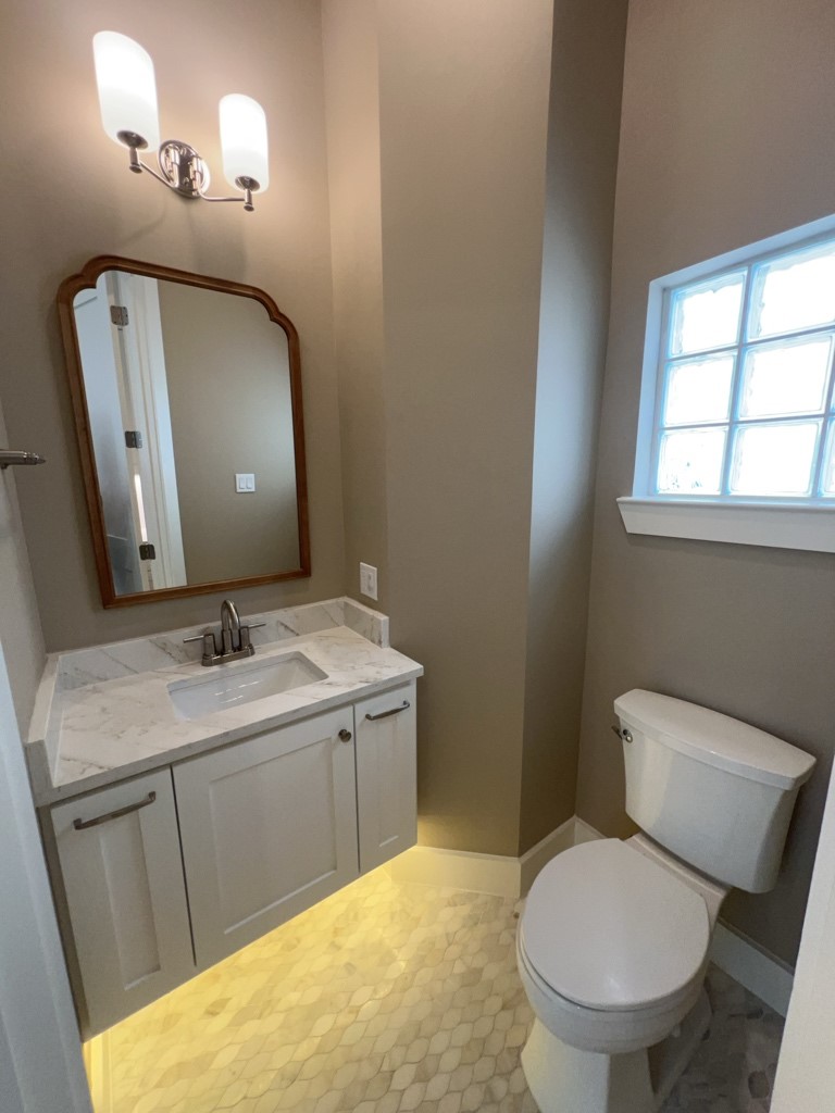 10607 Enclave Shadows Court Houston, TX 77043 - Photo 19 of 23 a bathroom with a sink and a mirror