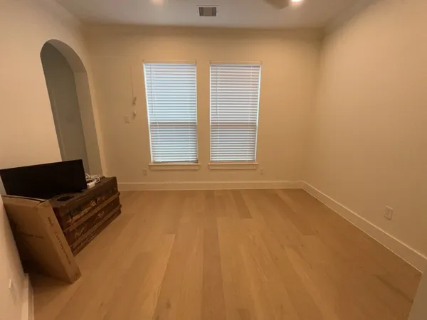 a view of room with window and furniture