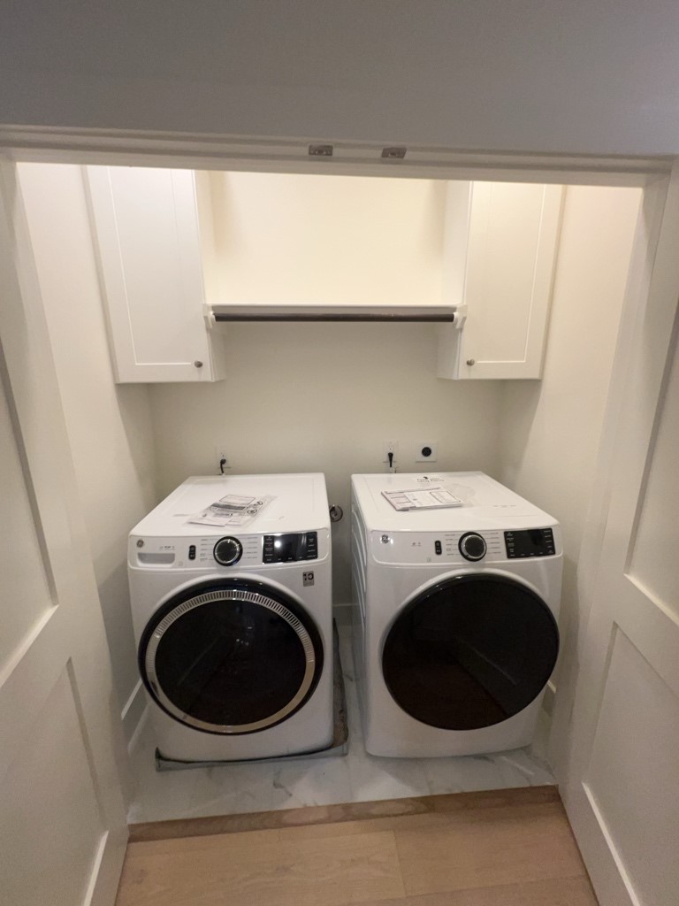 10607 Enclave Shadows Court Houston, TX 77043 - Photo 21 of 23 a utility room with dryer and washer