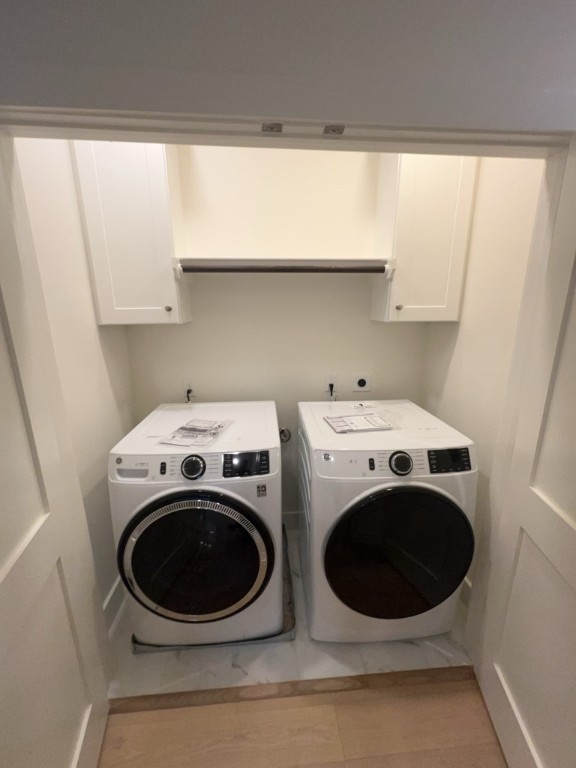 10607 Enclave Shadows Court Houston, TX 77043 - Photo 23 of 29 a utility room with dryer and washer