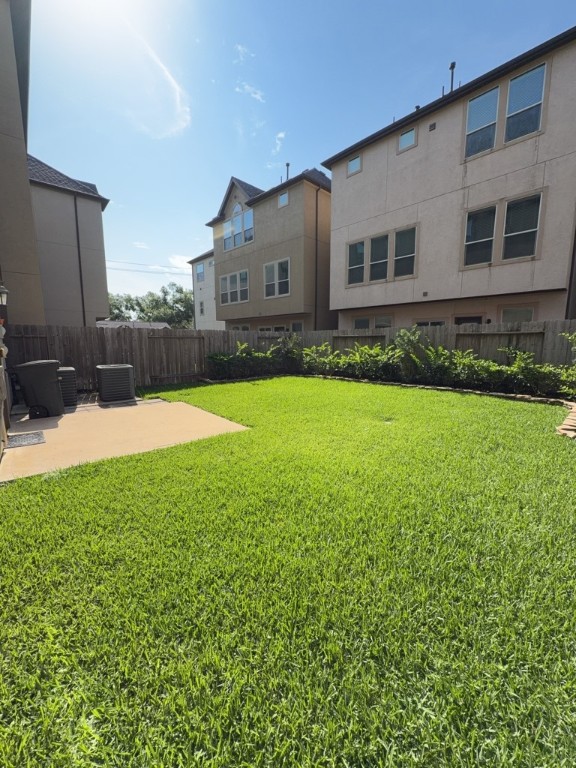 10607 Enclave Shadows Court Houston, TX 77043 - Photo 26 of 29 a view of a house with a backyard