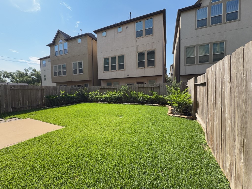 10607 Enclave Shadows Court Houston, TX 77043 - Photo 27 of 29 a view of backyard with patio