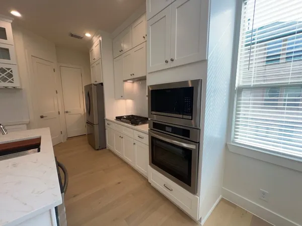 a kitchen with appliances and cabinets