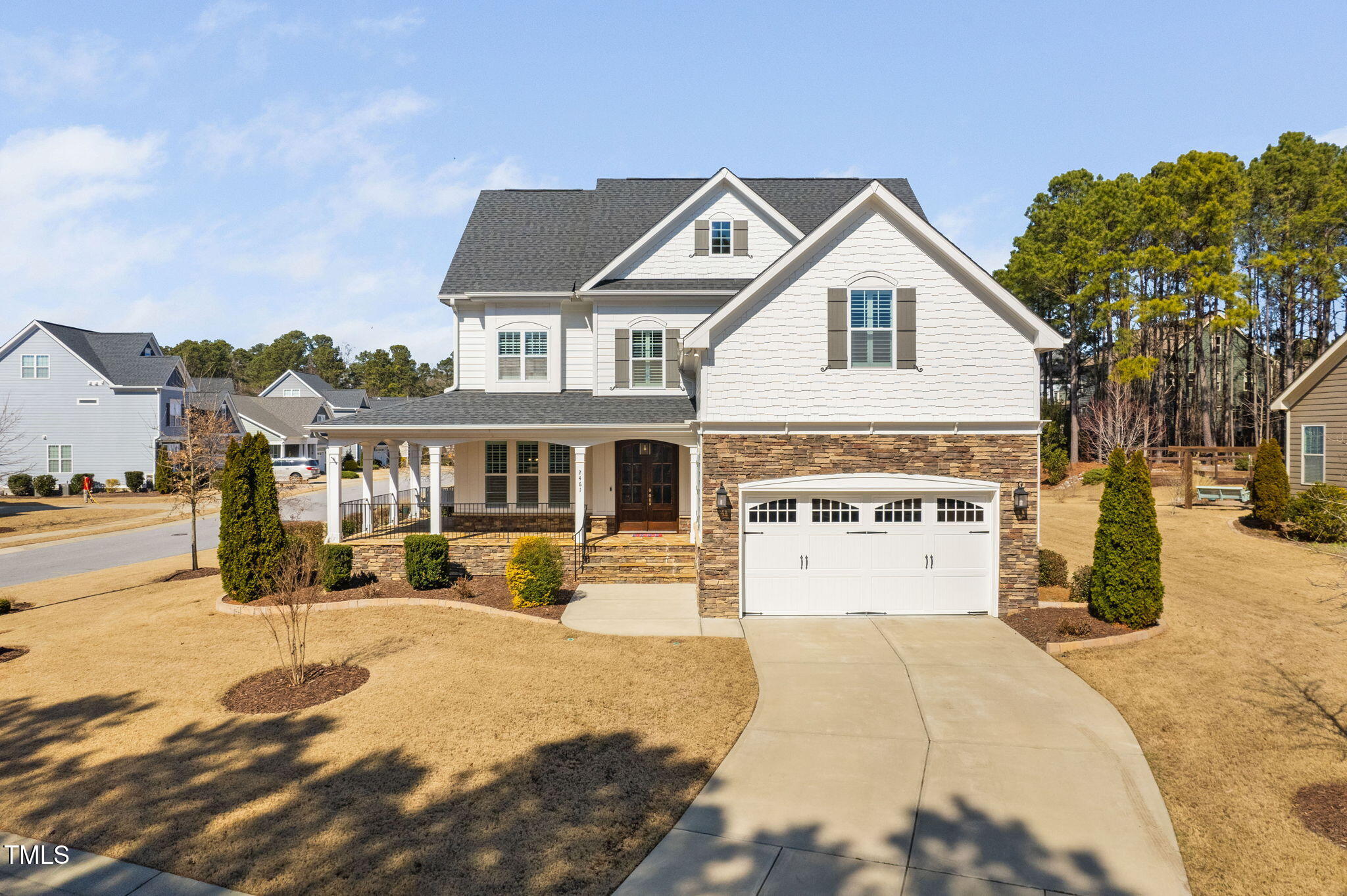 2461 Stonehenge Park Drive Raleigh, NC 27613 - Photo 1 of 72 a view of a white house with a yard and plants