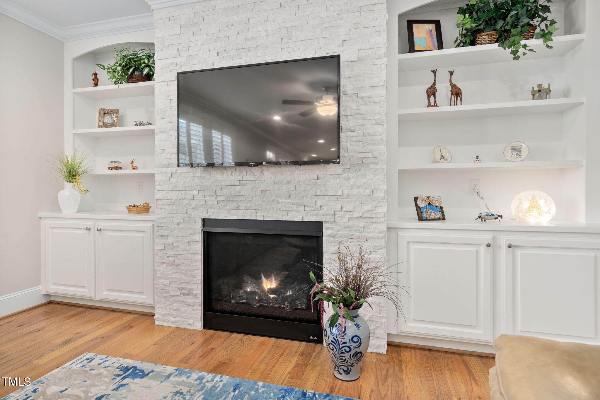 2461 Stonehenge Park Drive Raleigh, NC 27613 - Photo 16 of 72 a living room with furniture and a fireplace