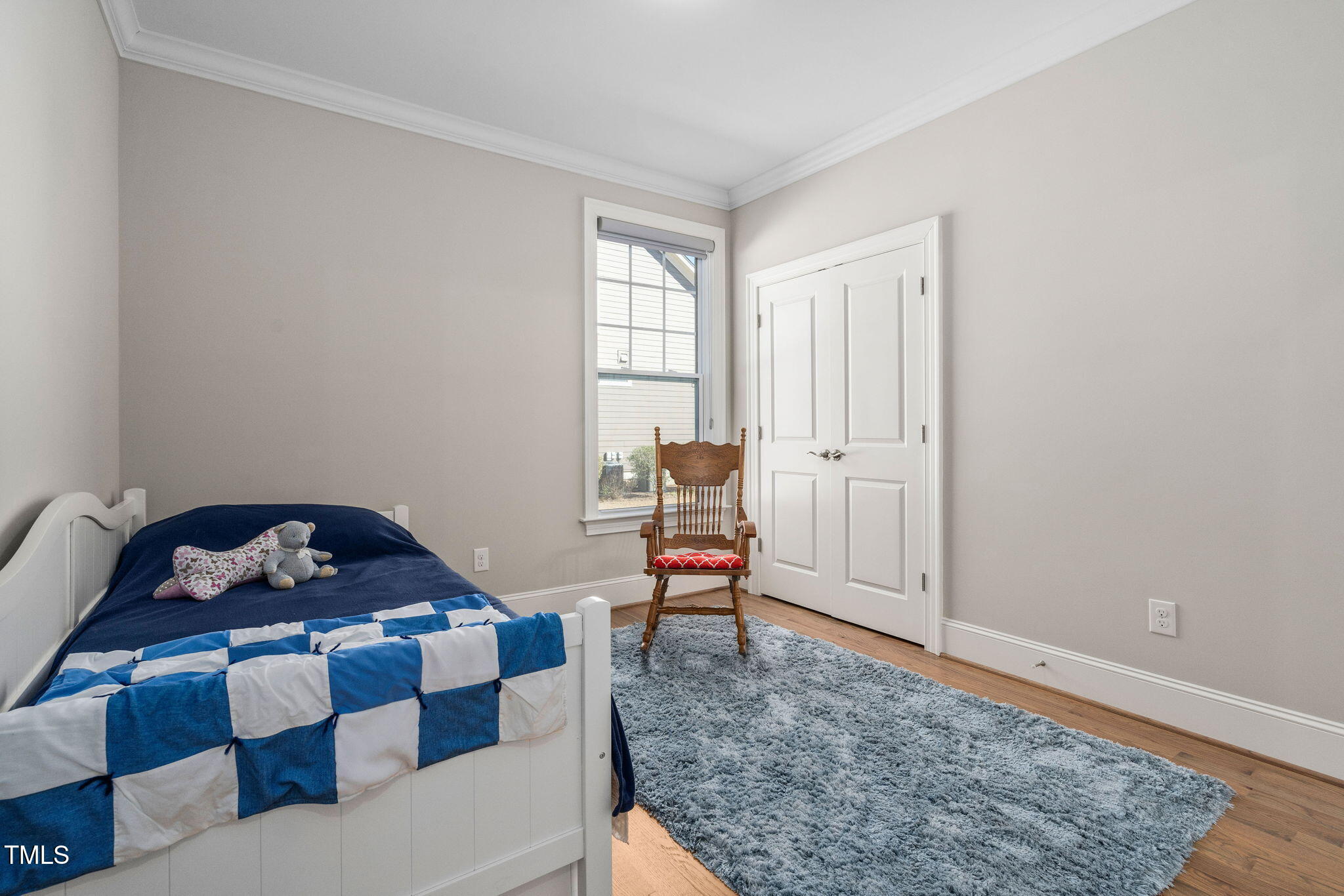 2461 Stonehenge Park Drive Raleigh, NC 27613 - Photo 18 of 72 a bedroom with a bed and wooden floor