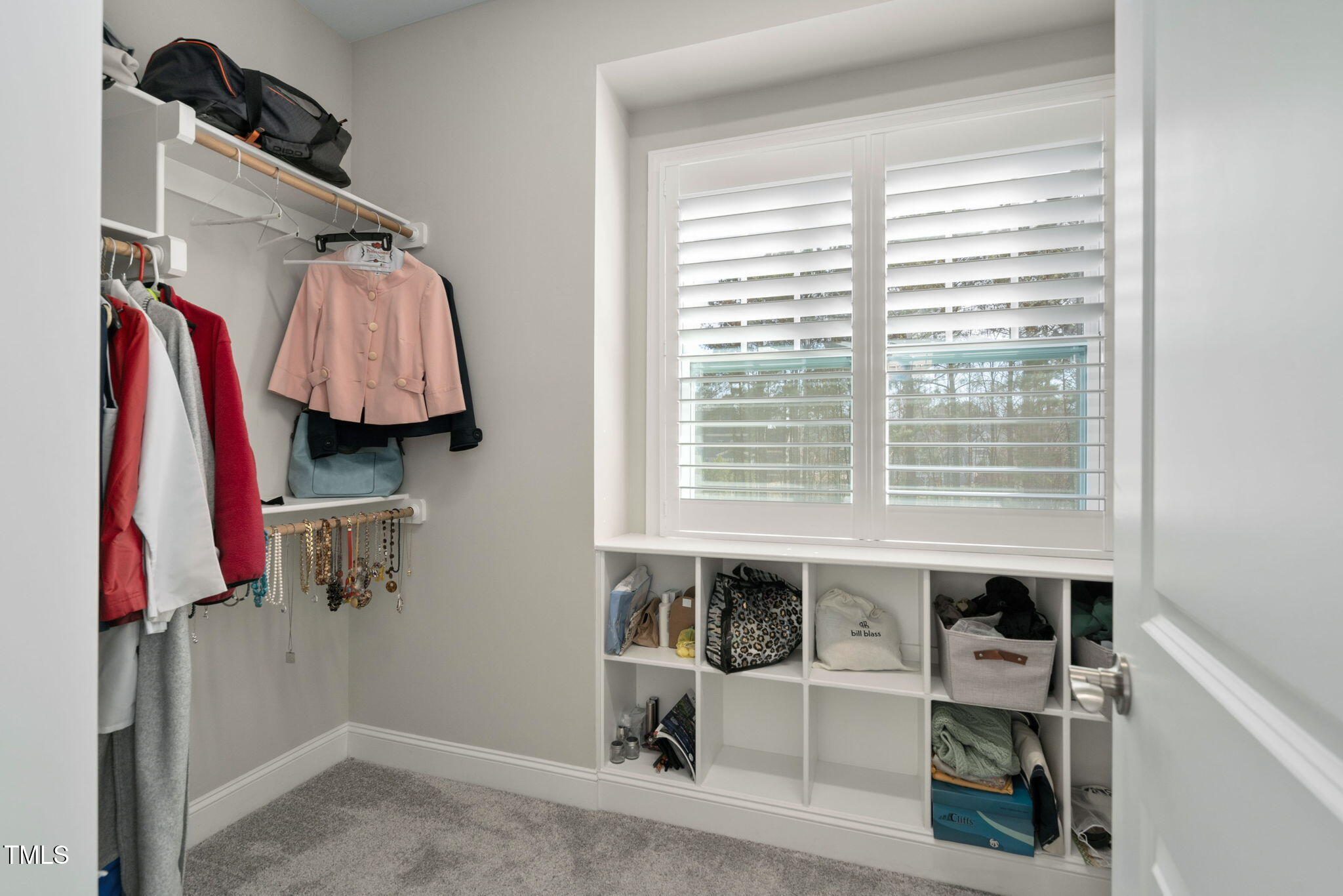 2461 Stonehenge Park Drive Raleigh, NC 27613 - Photo 29 of 72 a view of walk in closet with clothes and shoes