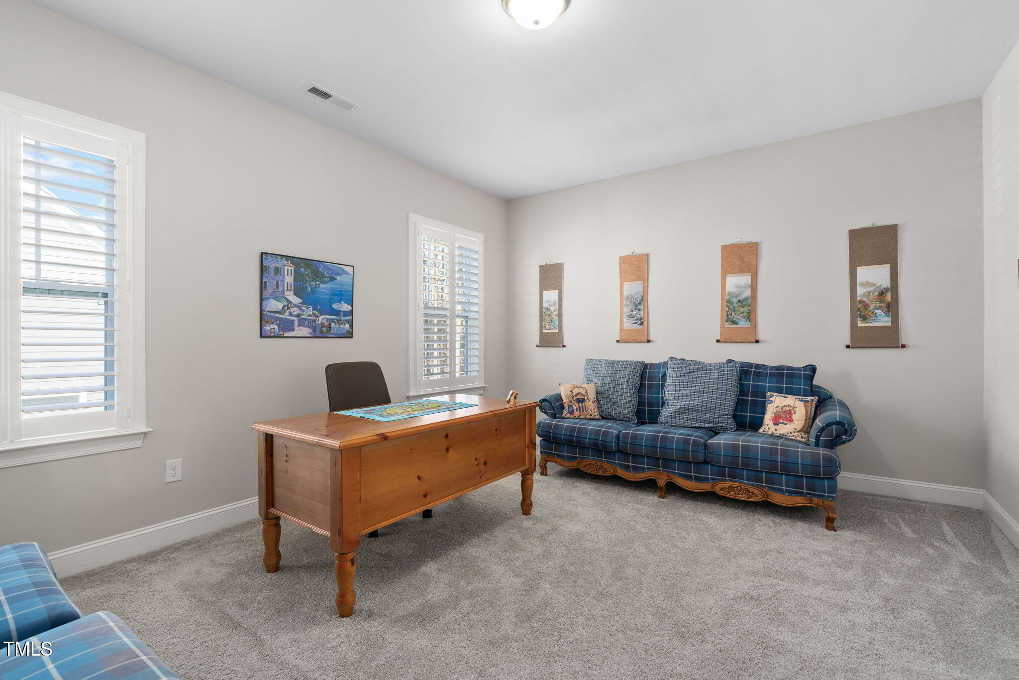 2461 Stonehenge Park Drive Raleigh, NC 27613 - Photo 35 of 72 a living room with furniture and a window