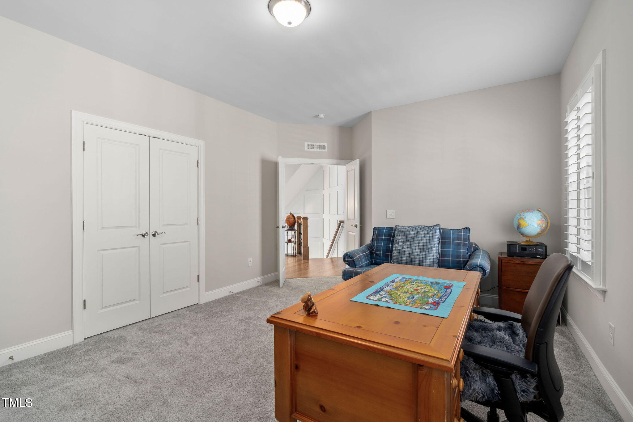 2461 Stonehenge Park Drive Raleigh, NC 27613 - Photo 36 of 72 a room with a bed and a table in it