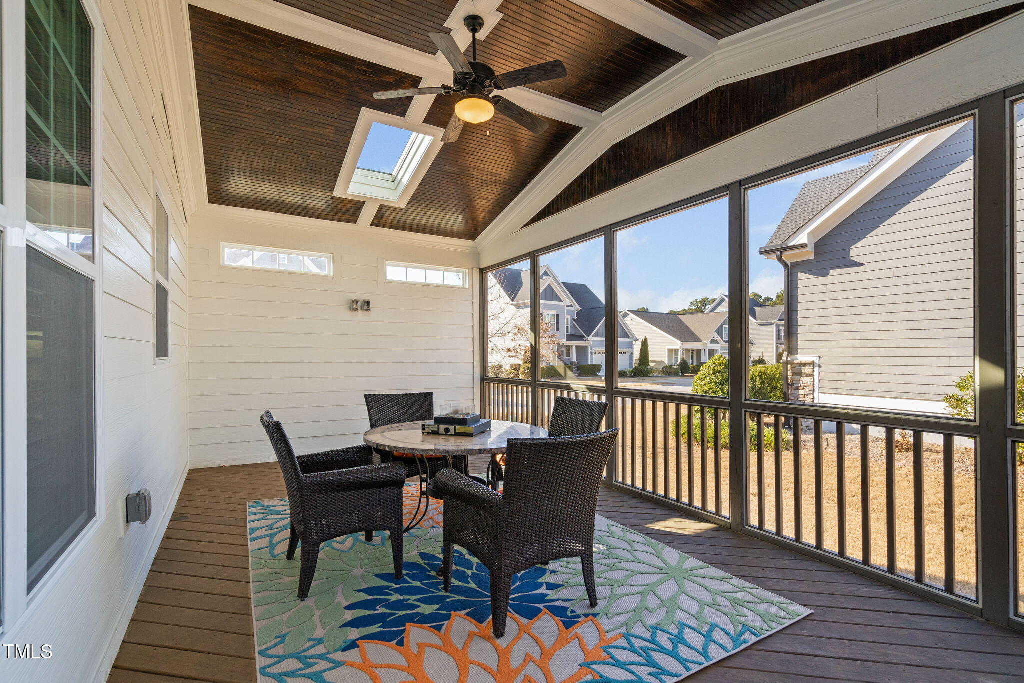 2461 Stonehenge Park Drive Raleigh, NC 27613 - Photo 48 of 72 a dining room with wooden floor glass table and chairs