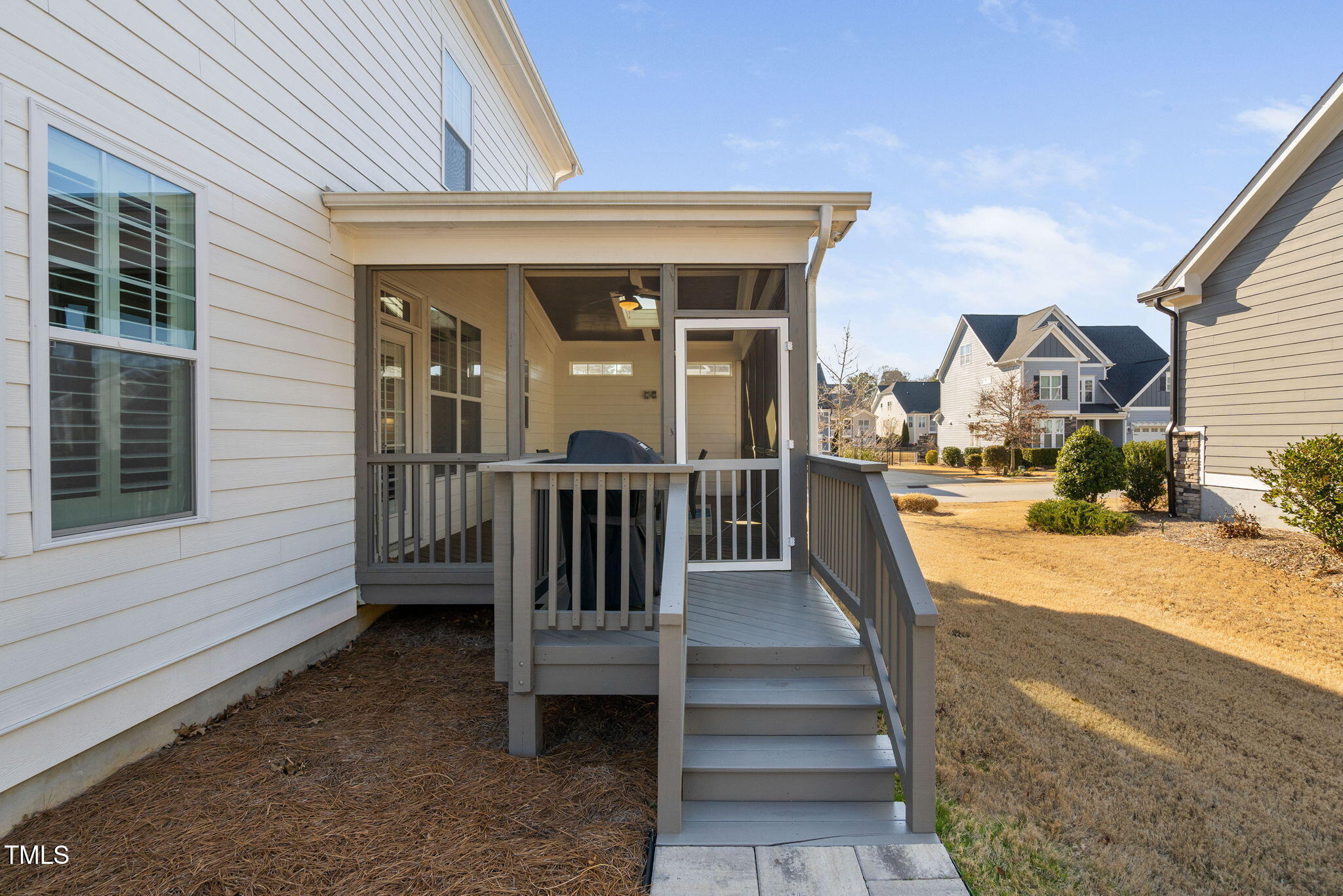 2461 Stonehenge Park Drive Raleigh, NC 27613 - Photo 51 of 72 a view of a building with wooden floor and floor to ceiling windows