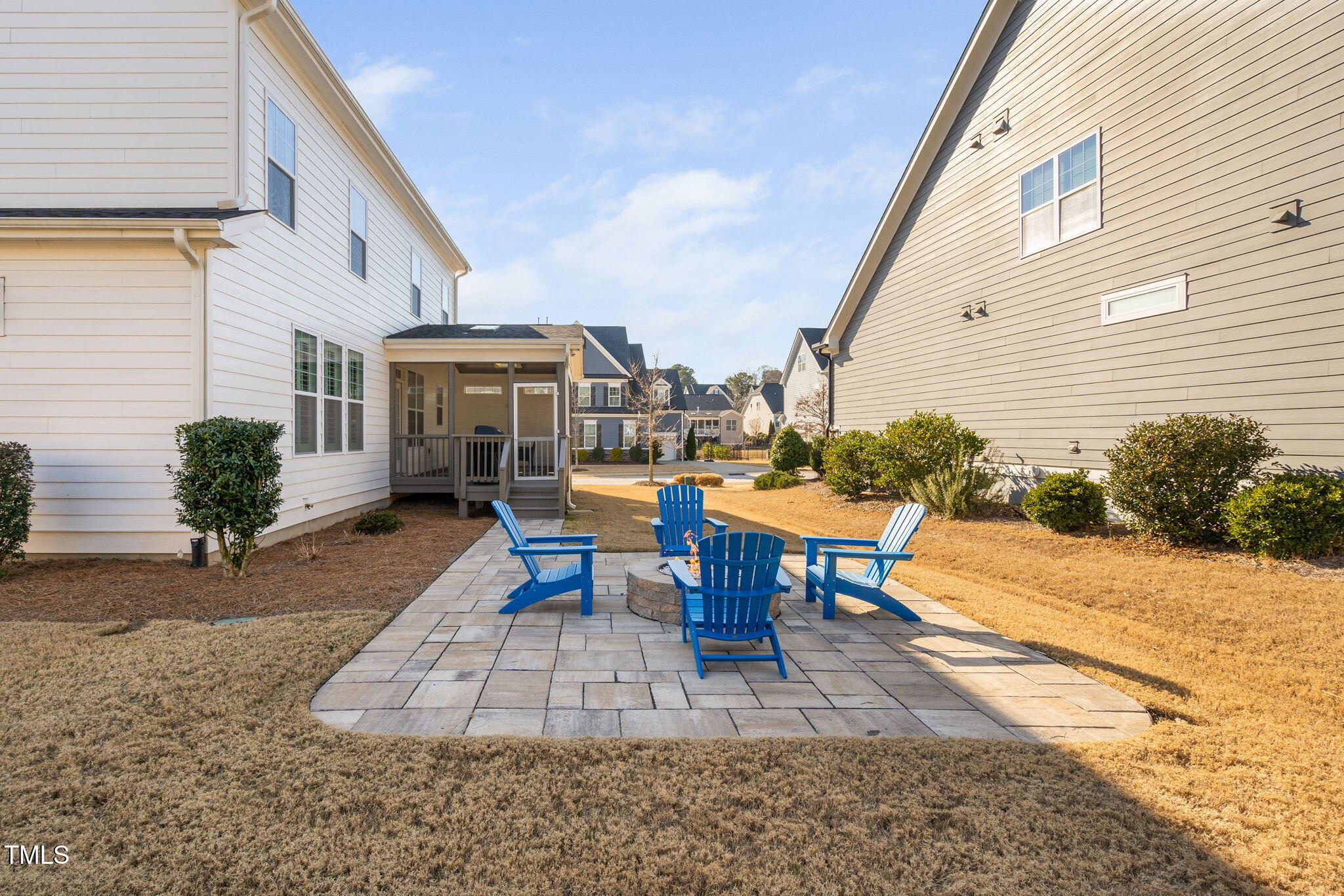 2461 Stonehenge Park Drive Raleigh, NC 27613 - Photo 52 of 72 a view of a patio with table and chairs floor to ceiling window and potted plants