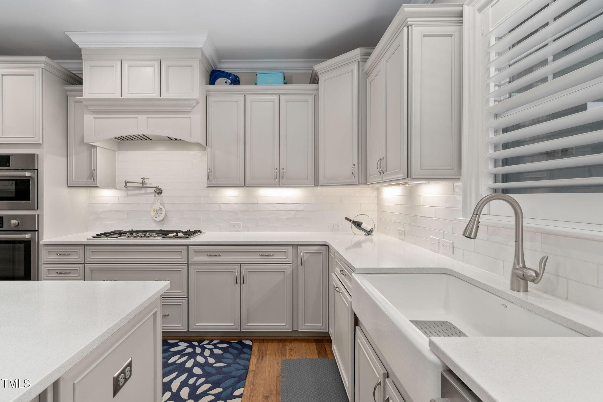 2461 Stonehenge Park Drive Raleigh, NC 27613 - Photo 10 of 72 a kitchen with a sink stove and cabinets