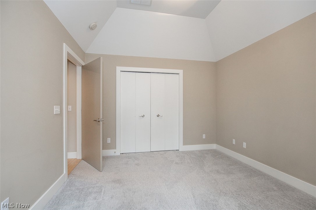 7282 Holzhauer Road Northfield, OH 44067 - Photo 20 of 47 Guest bedroom with vaulted ceiling