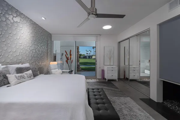 a bedroom with a bed and a fireplace