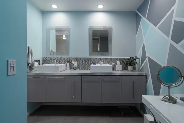 a bathroom with a sink and a mirror