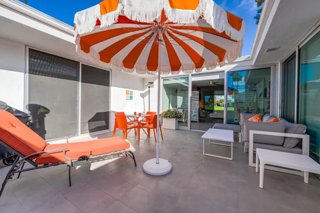 a backyard of a house with seating area