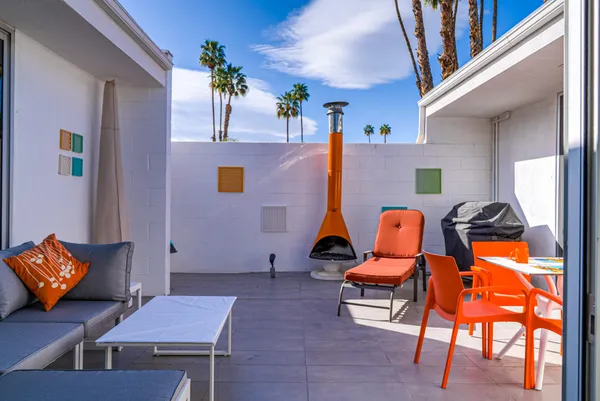 a outdoor space with patio the couches and a dining table with chairs