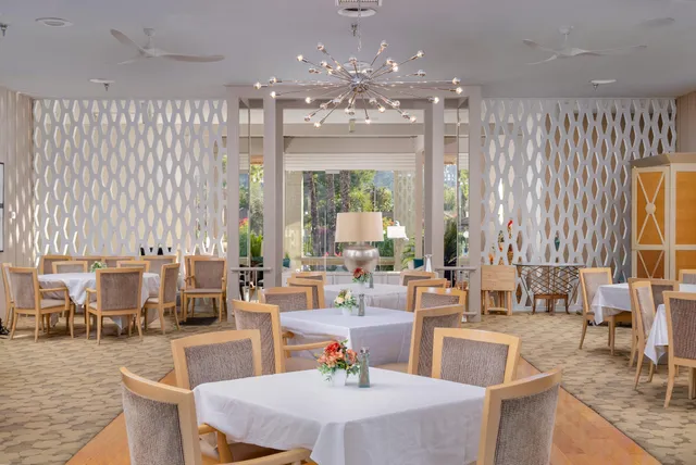 a very nice looking dining room with large window