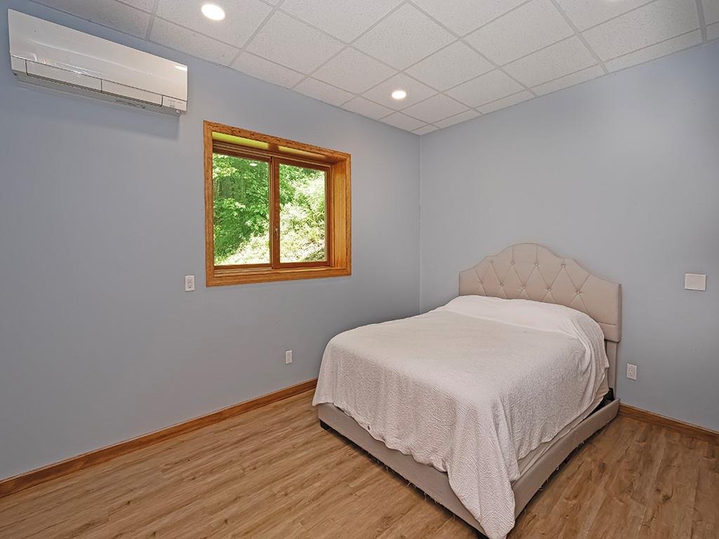 247 Rader School Road Renfrew, PA 16053 - Photo 13 of 28 a large bed sitting in a bedroom next to a window