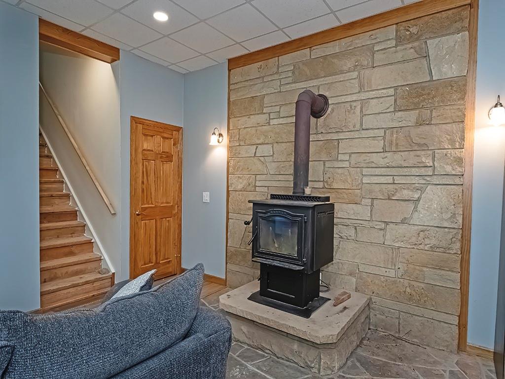 247 Rader School Road Renfrew, PA 16053 - Photo 15 of 28 a living room with a fireplace and a shower