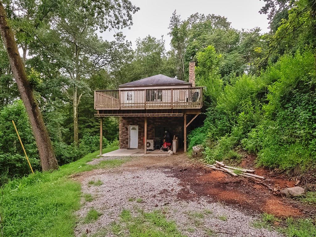 247 Rader School Road Renfrew, PA 16053 - Photo 28 of 28 a view of a wooden house with large trees and wooden fence