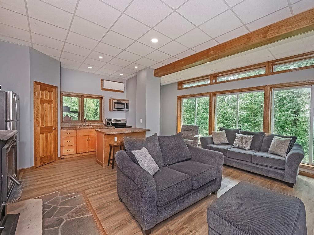 247 Rader School Road Renfrew, PA 16053 - Photo 4 of 28 a living room with furniture and a open kitchen view