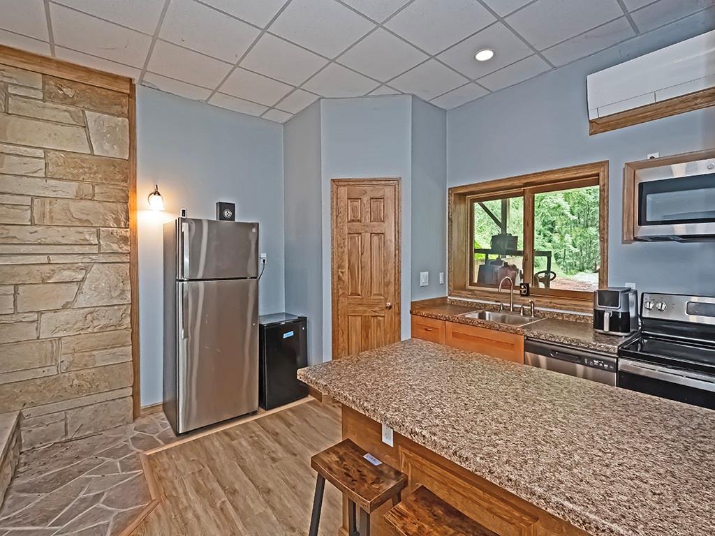 247 Rader School Road Renfrew, PA 16053 - Photo 8 of 28 a kitchen with stainless steel appliances granite countertop a refrigerator stove and sink