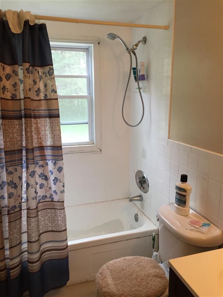 54 Kelley Road Hyannis, MA 02601 - Photo 8 of 11 a bathroom with a tub sink vanity and toilet