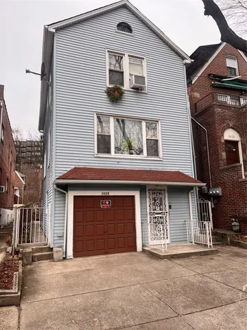 a front view of a house with a garage