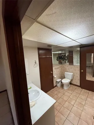 a bathroom with a sink and mirror