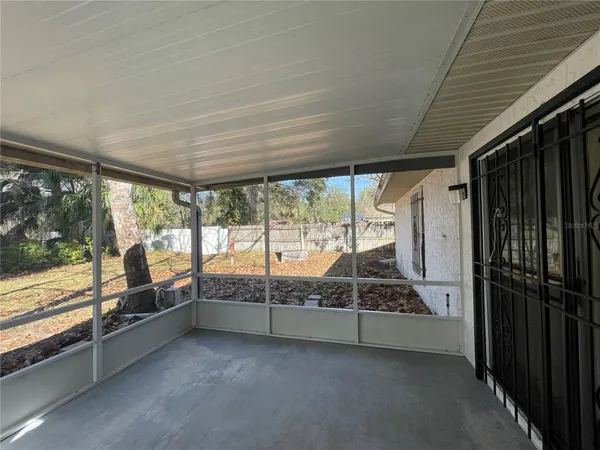 a view of an empty room with sliding door