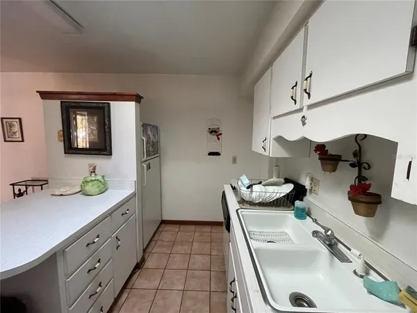 a kitchen with stainless steel appliances kitchen island granite countertop a sink and cabinets