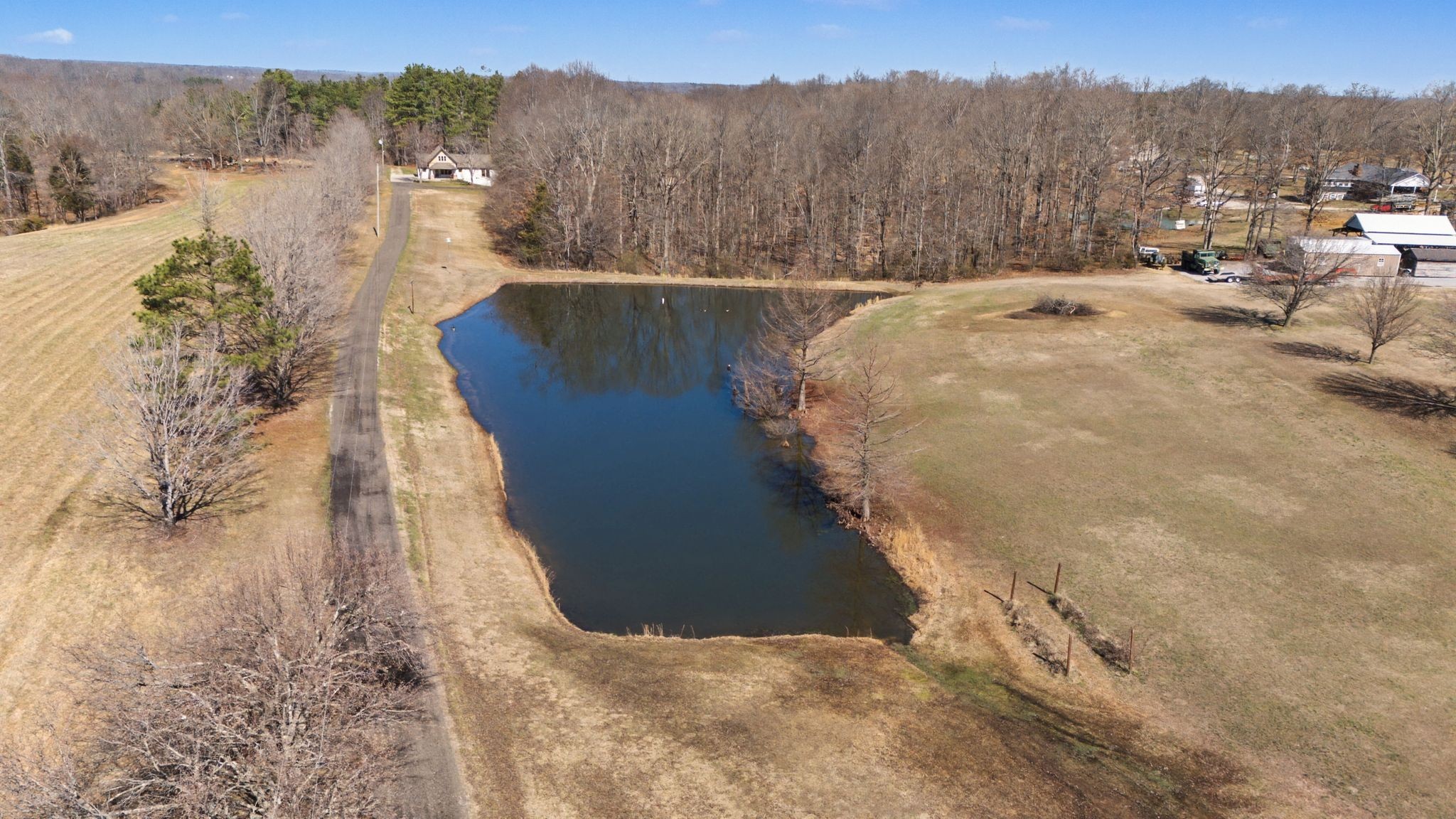1231 Abiff Road Bon Aqua, TN 37025 - Photo 52 of 60 a view of a lake with a mountain in the background