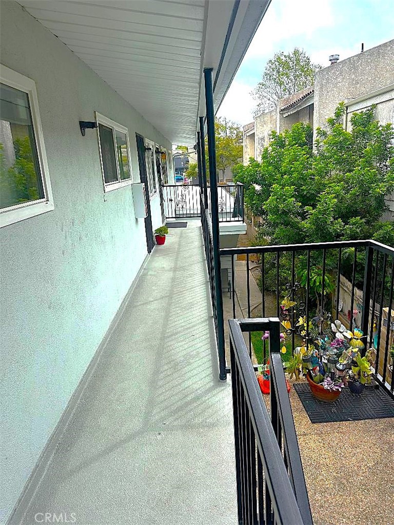 2202 Mathews Avenue Redondo Beach, CA 90278 - Photo 17 of 22 The Uppler Level Balcony Overlooks the Central Yard and Landscaping Trees.