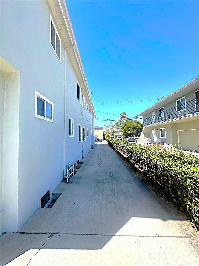 2202 Mathews Avenue Redondo Beach, CA 90278 - Photo 7 of 22 The long Driveway Leads From the Front of the Propeerty to the Rear Garages.