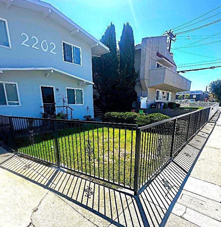 2202 Mathews Avenue Redondo Beach, CA 90278 - Photo 8 of 22 The Large Front Yard Area Recently had a Privacy Fence Surround Installed Offering Secure Use by the Tenants.