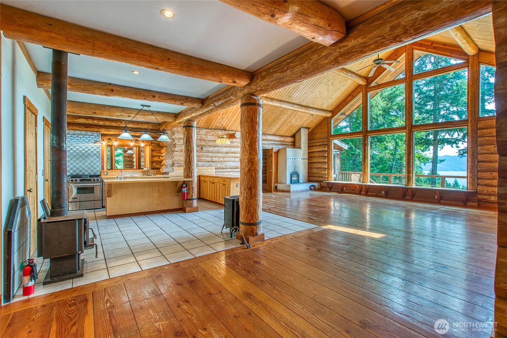 245 Roehl's Hill Road Orcas Island, WA 98279 - Photo 14 of 40 a view of an empty room with wooden floor and a window