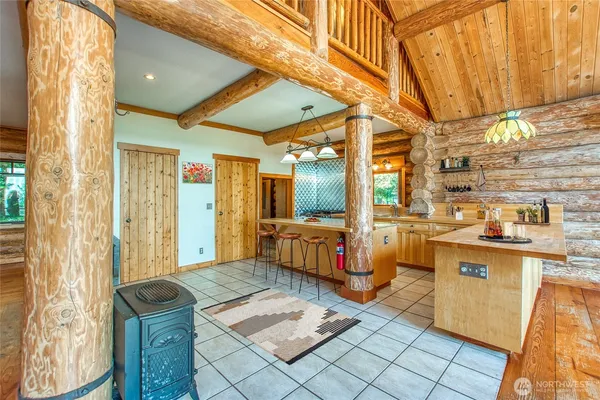 a kitchen with stainless steel appliances kitchen island granite countertop a sink and cabinets